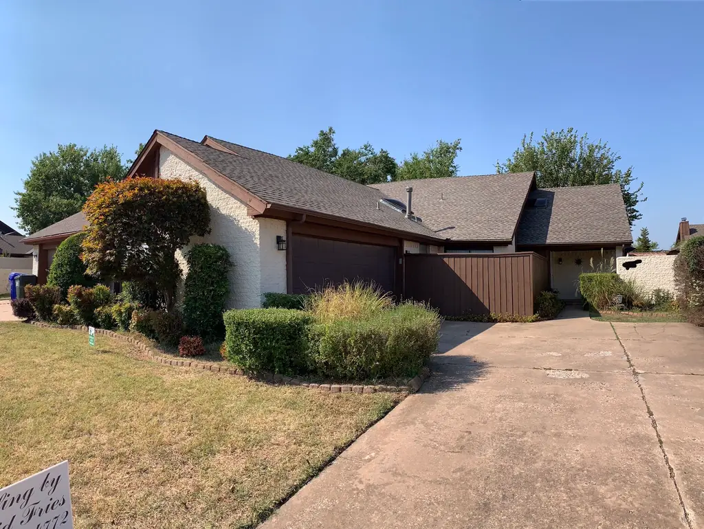 A finished architectural shingle roof on a Norman, Oklahoma home, completed by David Fries Roofing